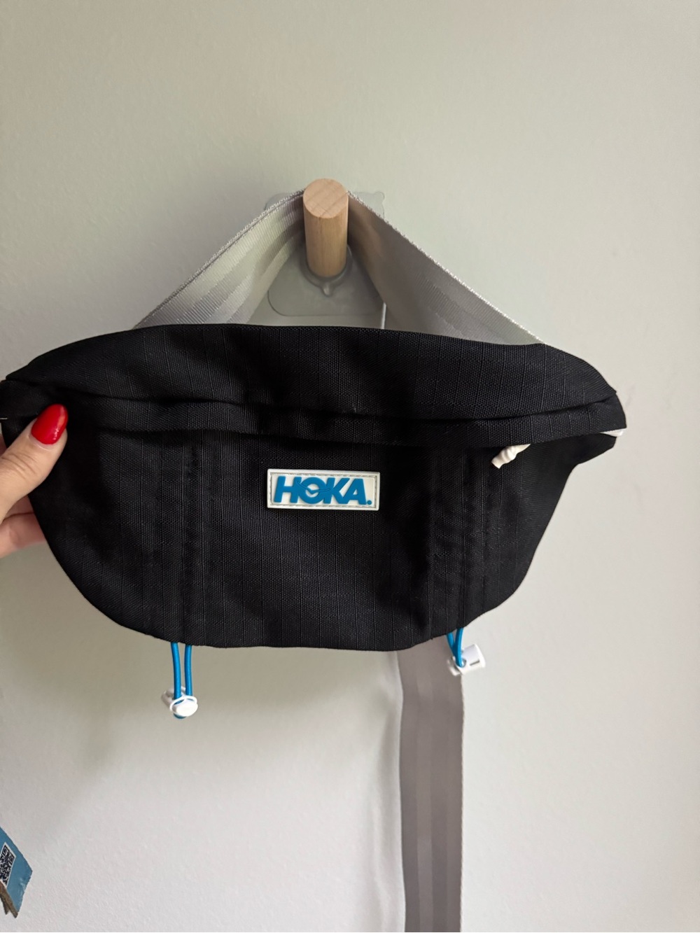 Hoka Black Waist Pack with Blue Logo and Pulls